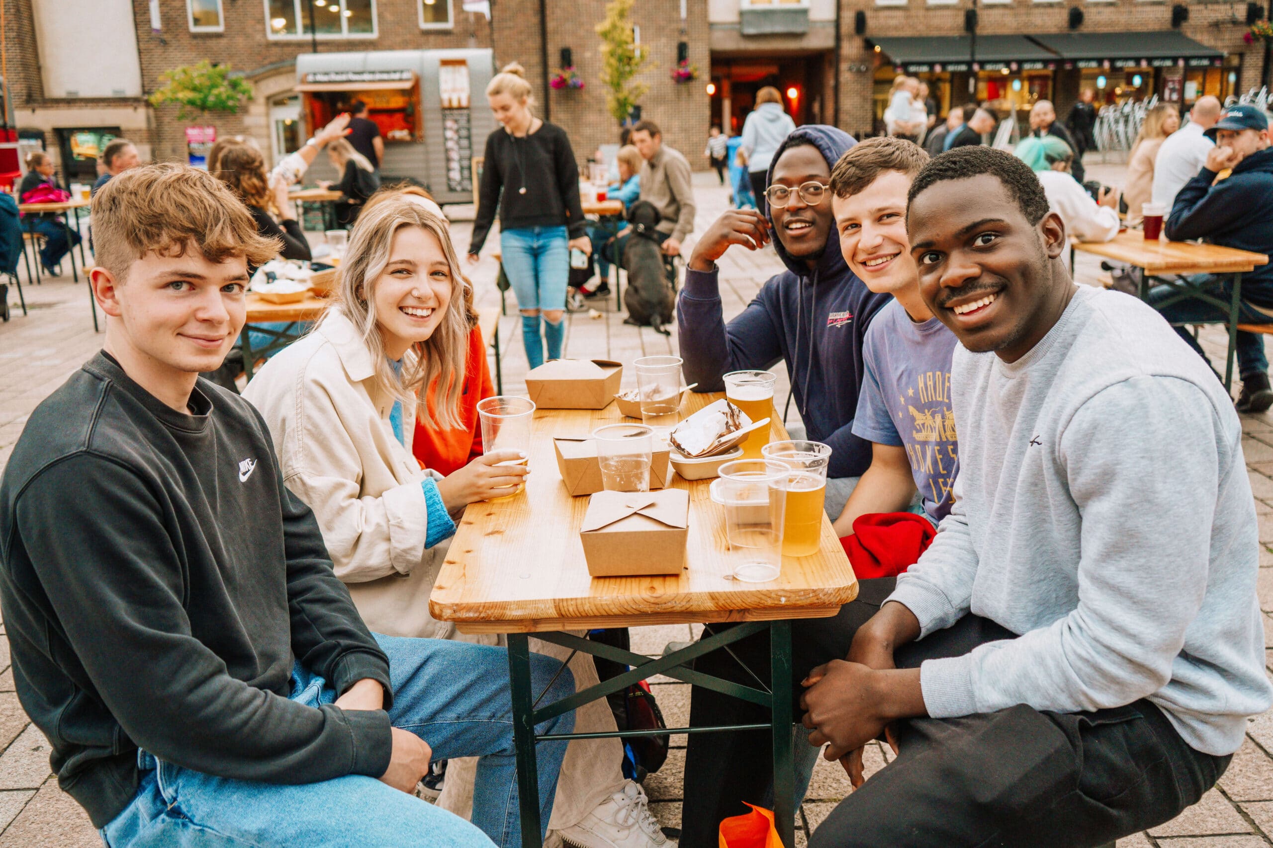 A group of young people enjoying outside area